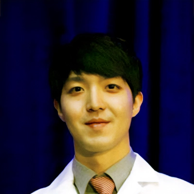 Dentist Urim Kang In Front Of Dark Blue Curtain With Caption